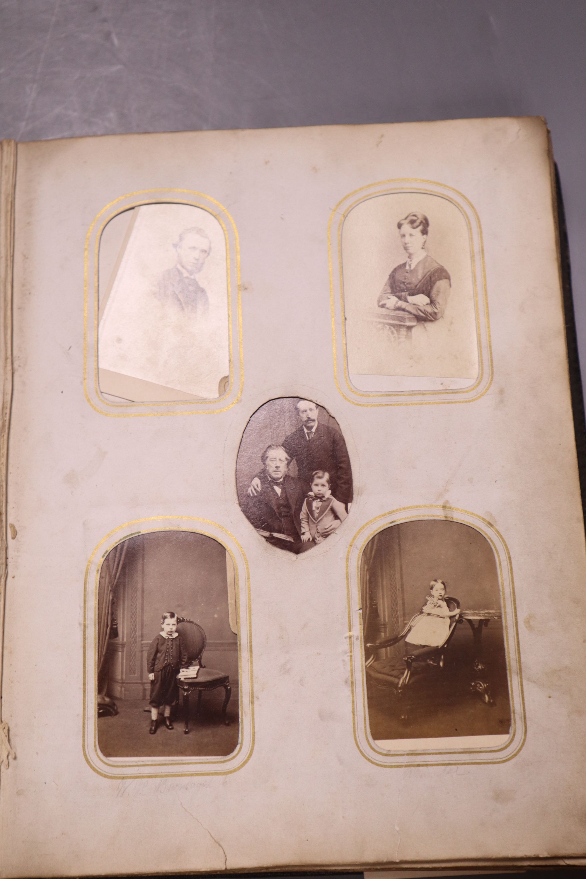 A Victorian album of cabinet portraits and one other sparsely mounted album (2)